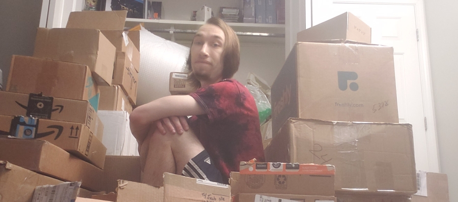 jacob olle pondering life surrounded by eBay boxes